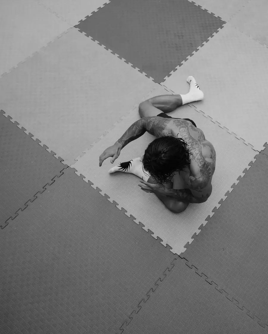 Grappler seen from above on training mats
